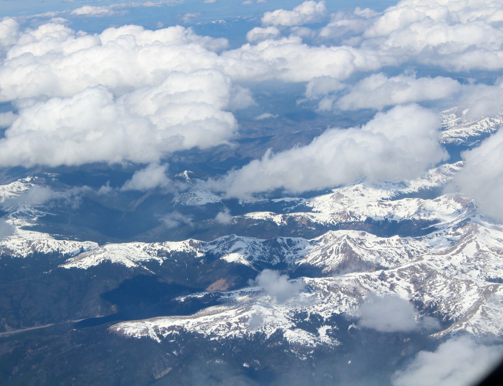 Aerial view of snow-capped Rocky Mountain peaks